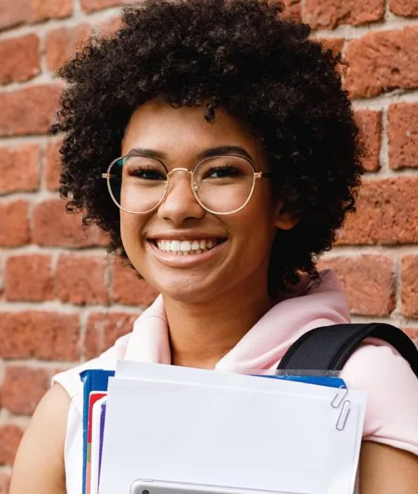 Student holding study notes, preparing for her entrance exam